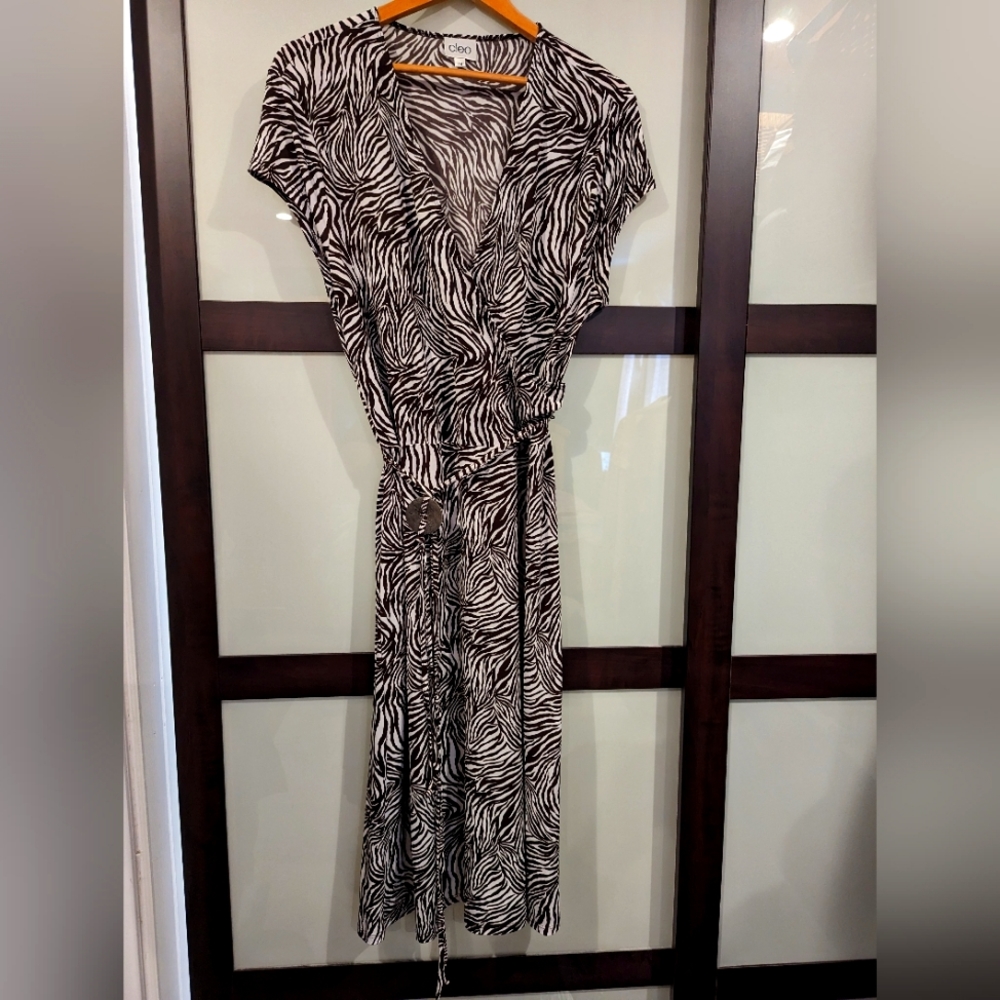 Figure flattering zebra stripe faux wrap dress.